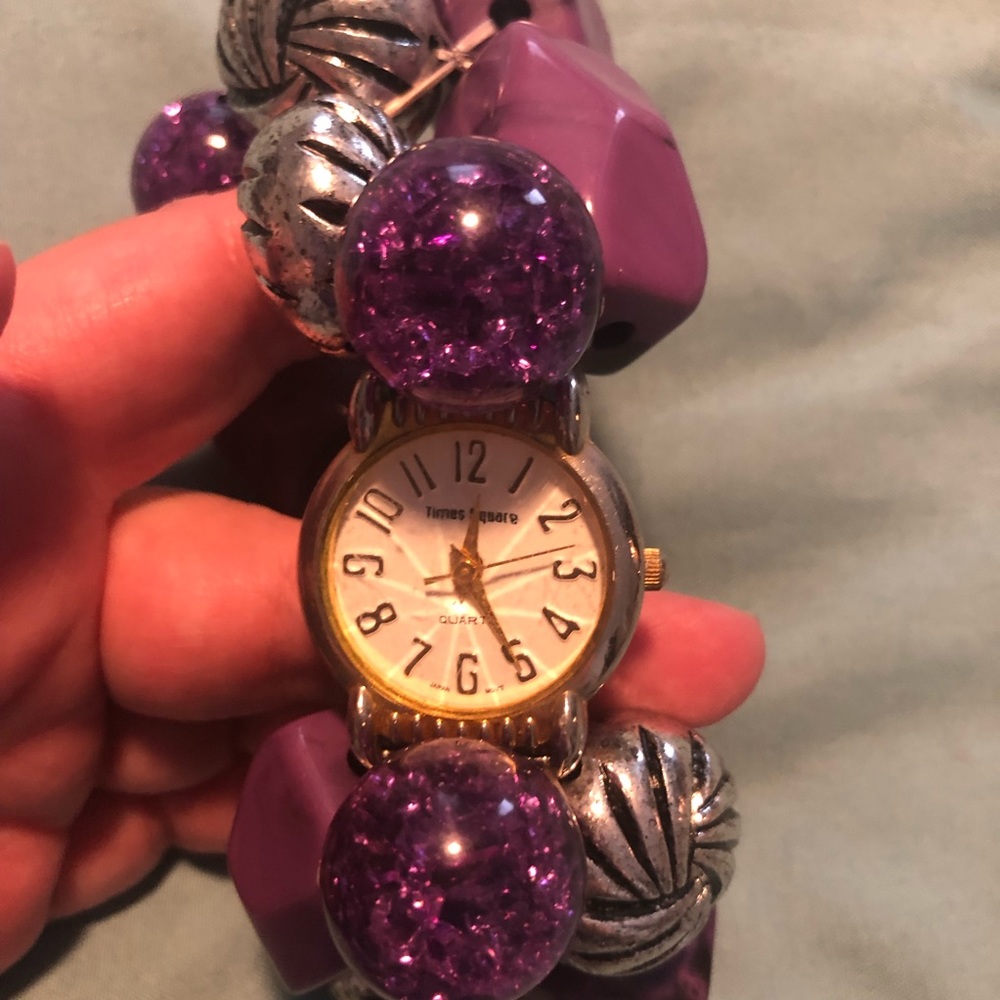Purple beaded bracelet with watch face